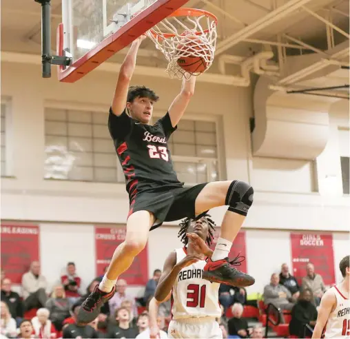  ?? ALLEN CUNNINGHAM/SUN-TIMES ?? Niko Abusara (13 points, eight rebounds) throws down a dunk for second-ranked Benet (27-1) in the second half of its victory over Marist (23-6).