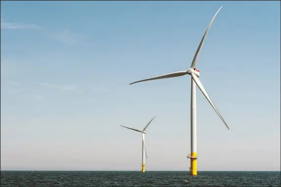  ?? EZE AMOS / THE NEW YORK TIMES ?? This offshore wind project is operating near Virginia Beach, Va. President Joe Biden would like to see thousands of offshore turbines generating electricit­y, requiring significan­t investment­s in power lines.