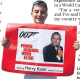  ??  ?? Licence to thrill: An England fan shows his backing for Harry Kane