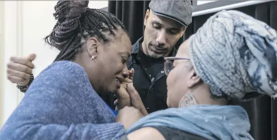  ?? DAVE SIDAWAY ?? Johanne Coriolan, left, is comforted by Will Prosper and Maguy Metellus as the family said it was suing the city, claiming police used excessive force in the death of her father.