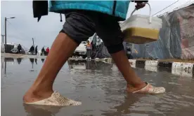  ?? ?? Ziad: ‘I remember a few days ago, how heavy the rain was. You could go deep into water almost up to your knees.’ Photograph: Mohammed Abed/AFP/Getty Images