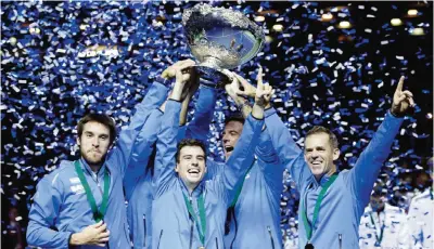  ??  ?? ZAGREB: Argentina’s players lift the trophy after winning the Davis Cup final in Zagreb, Croatia, Sunday. Argentina defeated Croatia 3-2 in the Davis — AP
