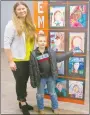  ?? Westside Eagle Observer/SUSAN HOLLAND ?? Young Logan Hansen, a second grader in Amber Sisemore’s class, poses with elementary art teacher Brandi Brown and points out his painting at the Glenn Duffy Elementary art show held Tuesday evening, March 8, at the Gravette Civic Center. Logan, 8, is the son of Matthew and Felicia Hansen of Gravette.