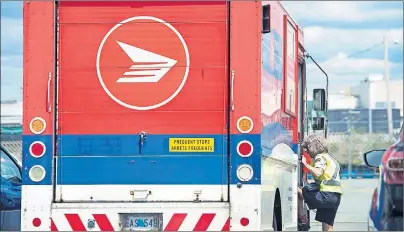  ?? CP PHOTO ?? Canada Post and its union are mulling over a possible 30-day cooling off period as the deadline for a postal service lockout looms.