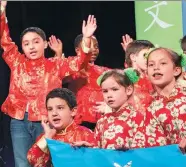  ?? MAY ZHOU / CHINA DAILY ?? Elementary school students from the Houston Independen­t School District perform Chinese songs and poems at the opening night of the 10th National Chinese Language Conference on Thursday in Houston, Texas.