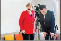  ?? AP/GEERT VANDEN WIJNGAERT ?? German Chancellor Angela Merkel and French President Emmanuel Macron, at the European Union summit in Brussels, spoke Thursday of concern over Britain’s lack of a deal for exiting the EU.