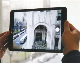  ??  ?? NEW YORK: A user takes a photograph through a window using a Samsung Galaxy Tab S3 tablet, in New York.—AP