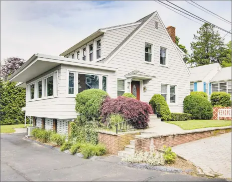  ?? Pearce Real Estate ?? This elegant colonial-style home at 6 Second Ave. in Branford provides four bedrooms along with three full bathrooms set within a 2,138-square-foot floor plan.