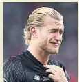  ??  ?? ALL CRIED OUT Karius shows his despair after final blunders