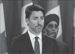  ?? Canadian Press photo ?? Prime Minister Justin Trudeau holds a news conference updating the Iran plane crash in Ottawa on Thursday as Defence Minister Harjit Sajjan looks on.