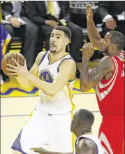  ?? TONY AVELAR / ASSOCIATED PRESS ?? Warriors guard Klay Thompson moves past the Rockets’ Trevor Ariza during Game 5 of the Western Conference finals Wednesday night. Thompson finished with 20 points in the Warriors’ victory.