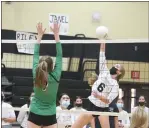  ?? CARLOS GUERRERO — DAILY DEMOCRAT ?? Pioneer High School’s Soquel Childers goes for a kill attempt against Dixon earlier this season.