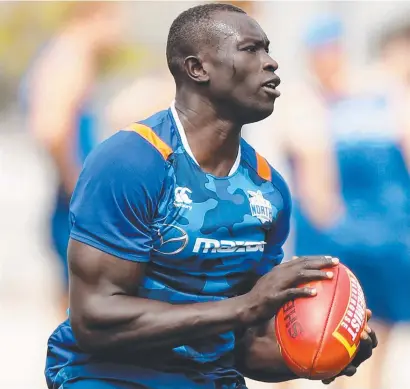  ??  ?? GUESS WHO’S BACK: North Melbourne’s Majak Daw is showing plenty of promise in defence.