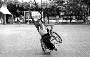  ?? OSWALDO RIVAS / REUTERS ?? A member of the Nicaragua wheelchair basketball team plays during a training session in the capital Managua on Wednesday.