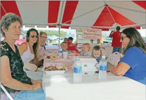  ?? FILE PHOTO ?? Eating chicken dinners at the 2016 Mount Nebo Chicken Fry are, from left, Judy Konkel, Brittney Bunting, Christie Talley, Talley Caldwell, twins Dax and Mercy Bunting and Kay Daugherty. The 2017 event is Saturday.