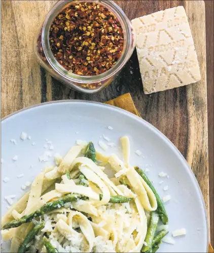  ?? DENISE WOODWARD ?? Arevalo’s Old School Fettucine Alfredo with Asparagus is an easy and delicious recipe to start your Pasta Friday tradition with family and friends.