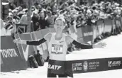  ?? JOHN AMIS AP ?? Galen Rupp crosses the finish line to win the U.S. Olympic men’s marathon trials in Atlanta.