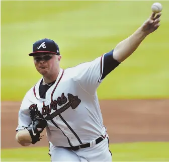  ??  ?? PITCHING IN: Braves starter Sean Newcomb of Brockton works in the first inning of his major league debut against the New York Mets yesterday in Atlanta. At right, he catches a breather in the later innings as he watches from the dugout.