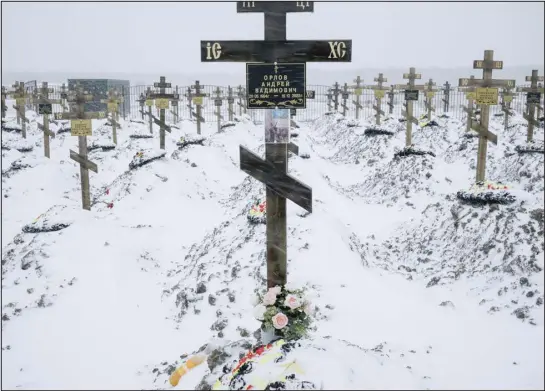  ?? PHOTOS BY NANNA HEITMANN — THE NEW YORK TIMES ?? The graves of Russian soldiers from the Wagner mercenary forces on the outskirts of Bakinskaya, Russia, are a testament to the huge casualties Russia is suffering in its invasion.