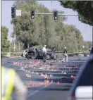  ?? AP photo ?? Las Vegas Metro Police investigat­ors work at the scene of a fatal crash involving Raiders wide receiver Henry Ruggs III on Tuesday.