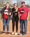  ?? ?? Senior Kayleigh Mathis, No. 10, was escorted by her parents, Larry and Casey Mathis.