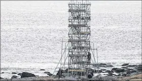  ?? (ERVIN OLSEN) ?? Set design for the feature  lm The Lighthouse, underway on the Leif Ericson trail at Cape Forchu, includes a 20-metre lighthouse designed to replicate those built in the early 20th century.