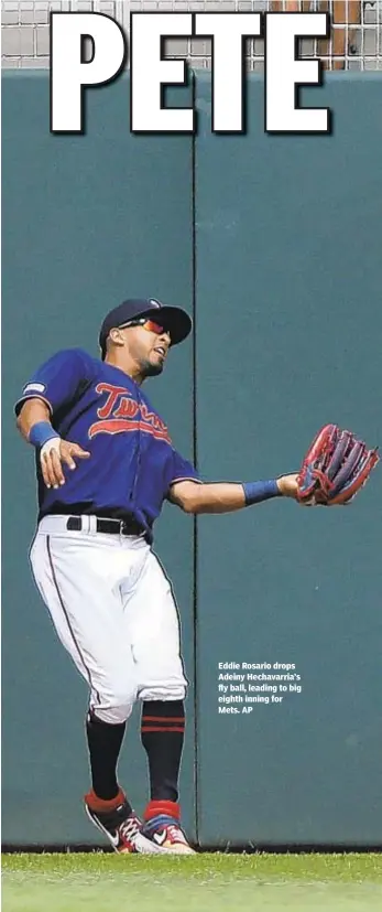  ??  ?? Eddie Rosario drops Adeiny Hechavarri­a’s fly ball, leading to big eighth inning for Mets. AP