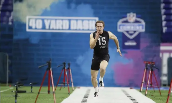  ?? AP ?? DIFFERENT APPROACH: Notre Dame wide receiver Chris Finke, seen running the 40-yard dash at the NFL Scouting Combine in Indianapol­is on Thursday, said the Patriots are different than other teams when it comes to their pre-draft interviews.