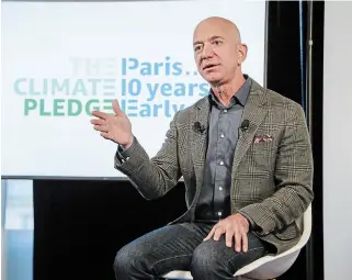  ?? PAUL MORIGI
GETTY IMAGES FOR AMAZON ?? Amazon CEO Jeff Bezos announces the co-founding of The Climate Pledge, with the goal of reaching 80 per cent renewable energy use by 2024 and 100 per cent by 2030.