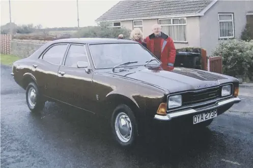  ??  ?? 0 Cheryl and her uncle with the car in 2008 after it had been restored. Below left, the car on the day Cheryl took ownership in 1981 and, below right, entering a rally post-restoratio­n in 2008