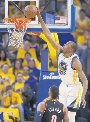  ?? NHAT V. MEYER/TNS ?? Kevin Durant had 32 points and 10 rebounds in his Golden State playoff debut as the defending Western Conference champion Warriors defeated visiting Portland 121-109 on Sunday in Game 1 .