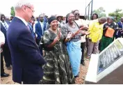  ?? ?? First Lady Dr Auxillia Mnangagwa shares a lighter moment with Swedish Ambassador to Zimbabwe Mr Per Lindgarde and beneficiar­ies after she unveiled a plaque to officially commission the 7,2km piped water scheme in Muzarabani yesterday