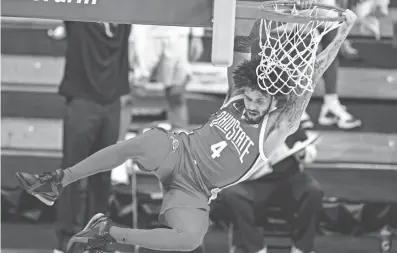  ?? MICHAEL CONROY/AP ?? Ohio State guard Duane Washington Jr. (4) follows through on a dunk against Purdue during the first half of their Big Ten Tournament game Friday in Indianapol­is.