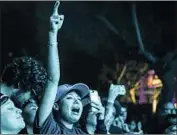  ??  ?? FANS SHOW their enthusiasm for New Order during the veteran group’s headlining set at the festival.