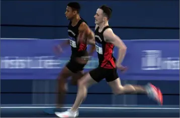  ??  ?? Menapians colleagues Leon Reid and David McDonald neck and neck in the men’s 200m final.