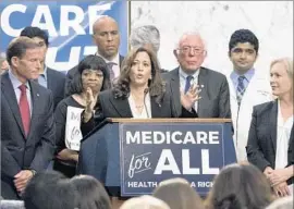  ?? Michael Reynolds European Pressphoto Agency ?? SEN. KAMALA HARRIS of California throws her support behind Sen. Bernie Sanders’ latest proposal to expand Medicare to cover all Americans.