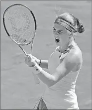  ?? AP/CHRISTOPHE ENA ?? Jelena Ostapenko dropped the first set against Simona Halep in the women’s French Open final Saturday, but she rallied to win the next two to become the first unseeded player to win the tournament since 1933.