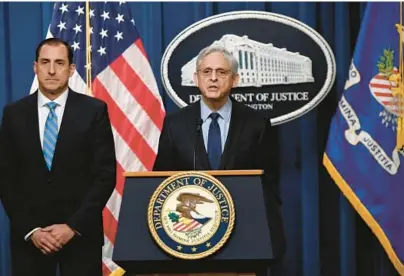  ?? OLIVIER DOULIERY/GETTY-AFP ?? U.S. Attorney General Merrick Garland names an independen­t special counsel to probe President Joe Biden’s alleged mishandlin­g of classified documents on Thursday. At left is U.S. Attorney for the Northern District of Illinois John Lausch.