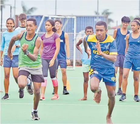  ?? Picture: JONACANI LALAKOBAU ?? Vilivo Whippy, right, and other athletes during the Suva primary schools athletics team training session at the National Hockey Centre at Laucala Bay, Suva yesterday.