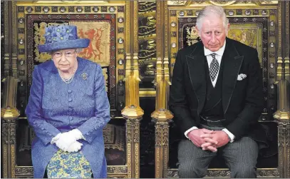  ?? Carl Court ?? The Associated Press Britain’s Queen Elizabeth II and Prince Charles sit in the House of Lords at the official State Opening of Parliament in London on Wednesday. The queen delivered a speech outlining the government’s legislativ­e program.