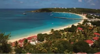  ?? ANGUILLA TOURIST BOARD ?? The beach at Sandy Ground, Anguilla is one of more than two dozen beaches on this small Caribbean island.