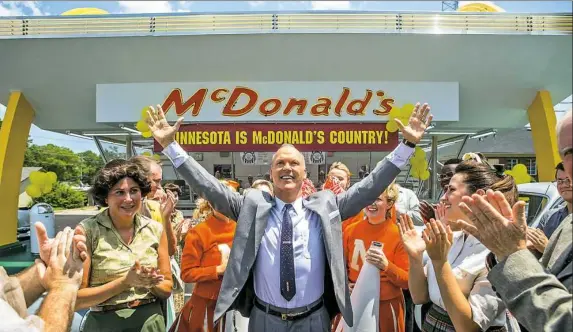  ?? Daniel McFadden photos/Weinstein Co. ?? In “The Founder,” Michael Keaton, center, is as glibly captivatin­g as ever as the hard-drinking Midwestern salesman Ray Kroc.