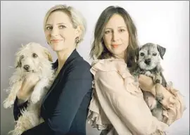  ?? Francine Orr Los Angeles Times ?? “BOUNDARIES” director Shana Feste, left, holds her dog Loretta, who made an unexpected appearance in the dramedy alongside Mary and star Vera Farmiga.