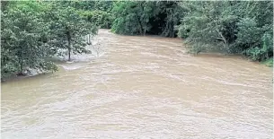  ??  ?? Forest runoff passes through Pongluek and Bangkloi villages before feeding into the Kaeng Krachan Dam in Phetchabur­i. The dam was at 98% of its capacity yesterday, with 701 million cubic metres of water, and was expected to overflow its spillway at...