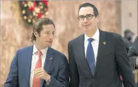  ?? Drew Angerer Getty Images ?? STEVEN MNUCHIN, right, with Trump campaign official Eli Miller, was chairman of OneWest Bank, whose foreclosur­e practices drew complaints.