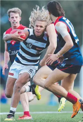  ?? Picture: MICHAEL KLEIN ?? TOUGH GOING: Geelong's Quinton Narkle tries to fend his way through traffic against Casey Scorpions on Saturday. “He got tight (in the hamstring) before halftime,” O’Bree said. “He tried to come on in the third and was still pretty tight, so we took the conservati­ve approach with him.” Finished the day early with only six touches. ZAC SMITH “Their rucks impacted more than Zac,” O’Bree said. “Obviously he got his hands to the ball, but I thought their rucks played really well, not just in the hitout area but around the ground.” Had 51 hitouts, but had just five disposals and one mark. ESAVA RATUGOLEA Quiet game in his second match back. Just four disposals and two marks, but spent more time in the ruck this week, claiming 18 hitouts and playing full game time. JORDAN CUNICO Was not the worst, with 18 touches, four marks, five tackles and four clearances. LINCOLN McCARTHY Quiet game with nine disposals, one tackle and two behinds. JACKSON THURLOW Had only one touch to halftime but finished with 14 disposals, five clearances and four rebound-50s. QUINTON NARKLE Thirteen disposals, one goal and two tackles in a quieter-than-usual game from Narkle.