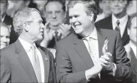  ?? J. Pat Carter
Associated Press ?? THEN-PRESIDENT George W. Bush and then-Florida Gov. Jeb Bush in 2002. Jeb worked behind the scenes to help his brother win Florida’s disputed 2000 vote.