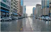  ?? — Photo by M. Sajjad ?? The King Abdul Aziz Road in Sharjah is filled with rainwater on Monday.