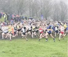  ??  ?? Off they go
Runners at the start of the men’s senior race