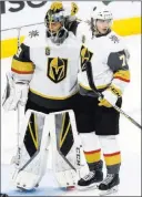  ??  ?? Golden Knights goaltender Marc-andre Fleury and center William Karlsson celebrate after a 3-2 victory gave
Vegas a 3-0 lead over the Kings in their Western Conference quarterfin­al series.